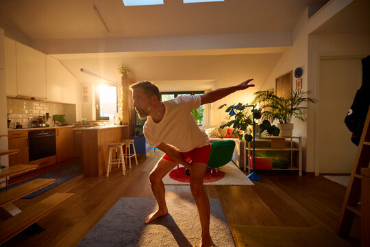 Man performs body exercises in the morning