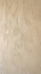 Fototapeta premium Close up of textured plaster wall surface showing natural variations with interior