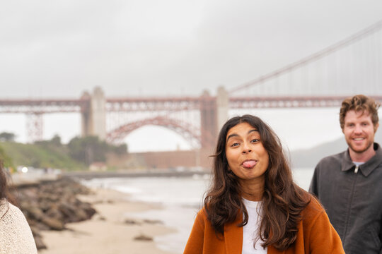 playful woman sticking tongue out at camera 