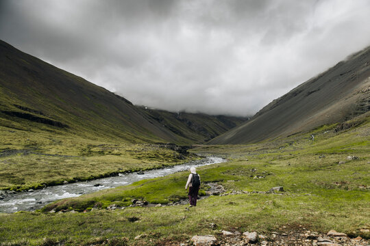 Hiker in Icelandic Mountain Valley