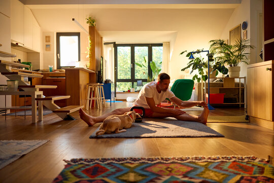 Active man doing workouts at home