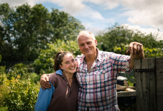 Smiling together at the garden gate