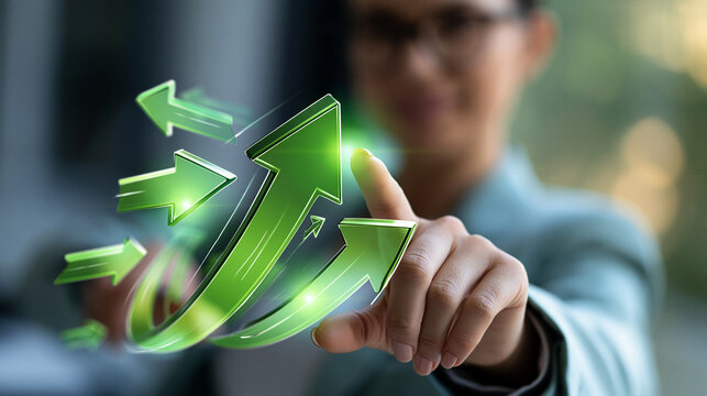 Faceless businesswoman pointing to large green up arrow surrounded by multiple directional arrows, growth and strategy concept, defocused background, with copy space
