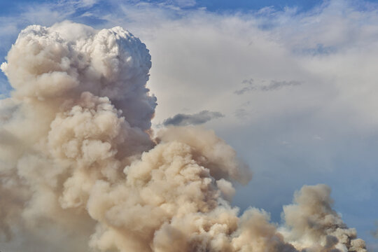Massive Wildfire Smoke Plume Over Rural Landscape