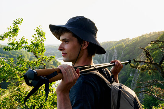 Hiking on a Mountain Trail at Sunset Near a River