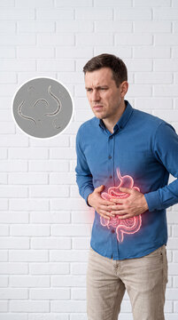 Man with Highlighted Intestinal Tract Holding Stomach