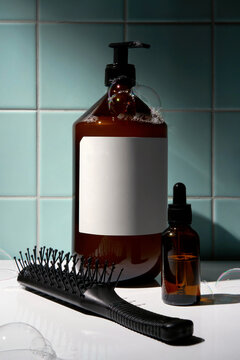 Hair Care Products with Hairbrush and Soap Bubbles in Modern Bathroom
