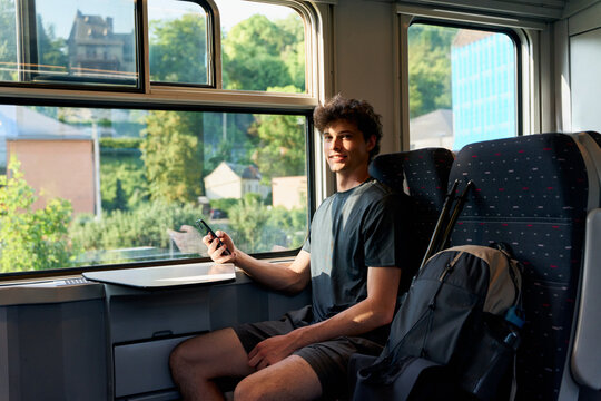Traveling on a Train and Enjoying the View on a Sunny Day