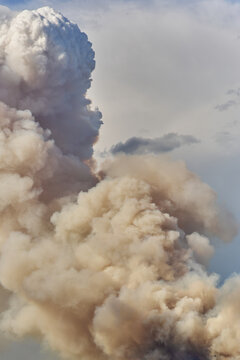Massive Wildfire Smoke Plume Over Rural Landscape