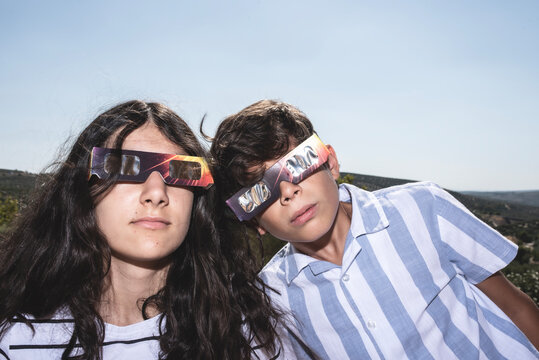 Children Wearing Protective Glasses During a Solar Eclipse