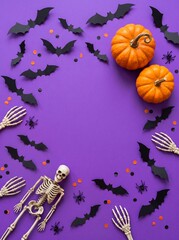 Obraz premium Halloween background with pumpkins skeleton and bats arranged in a circular frame on a vibrant purple surface