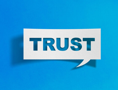 Trust word in speech bubble on blue background with paper cutout design