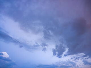 Dramatic blue and purple sky with drifting clouds © Levon