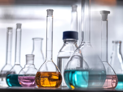 Colorful liquid fills lab glassware during a chemistry experiment