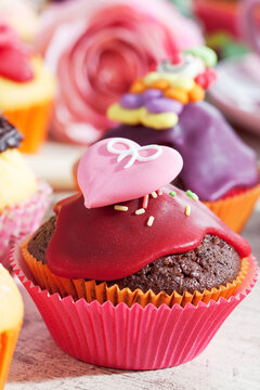 Decorated chocolate muffins in muffin papers