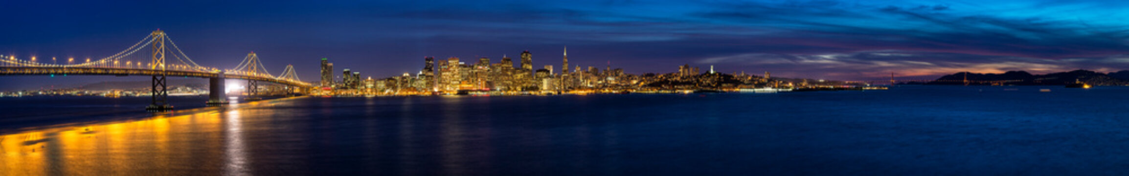 USA, California, San Francisco, Skyline and Oakland Bay Bridge in the evening