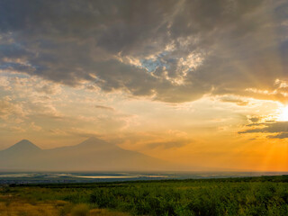 Fototapeta premium Dramatic sunset behind mountain peaks