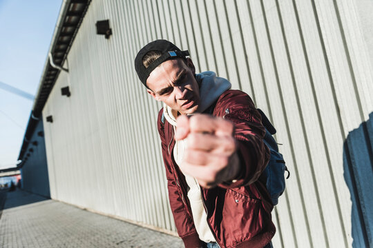 Portrait of aggressive young man making a fist