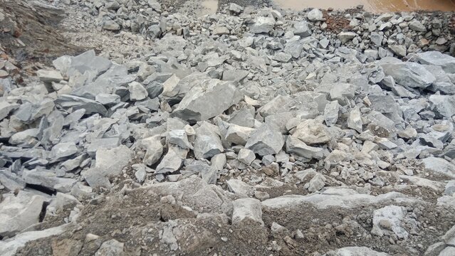 Crushed Grey Limestone Rocks and Aggregate Surface at Quarry Site