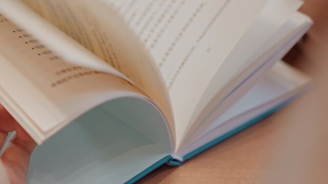 Closeup paper and fingertips tracing text, textured pages curling, delicate nail art detail, tactile turning, macro view of spine and print, poet or editor gently reviewing lines, soft pastel cover,
