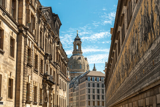 Augustusstrasse with the Procession of Princes mural and Frauenkirche dome in the historic old town of Dresden, Germany