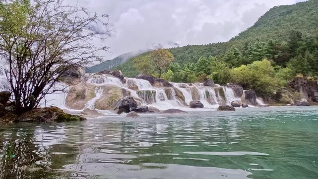 Waterfall Timelapse into Turquoise Lake, Blue Moon Valley, Lijiang, China
