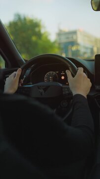 Man driving car through the streets of the city.