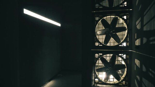 Gloomy factory corridor with shadows cast. Sombre industrial passage illuminated by faint LED lights and dramatic metal grilles creating shadows