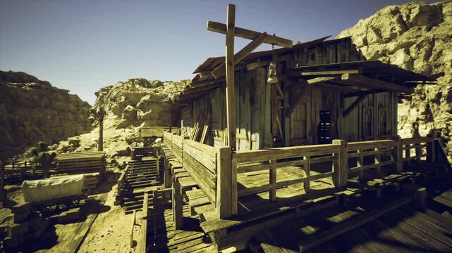 Sunlit Namibian wooden platform in desert, weathered planks and rail ties, warm golden light, distant rocky hills, deep contrast shadows, abandoned outpost mood