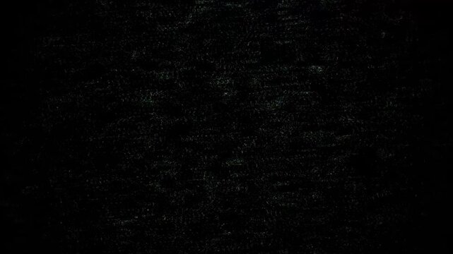 Abstract shimmering particles creating a minimalist dark background, digital texture with subtle light speckles for artistic projects.