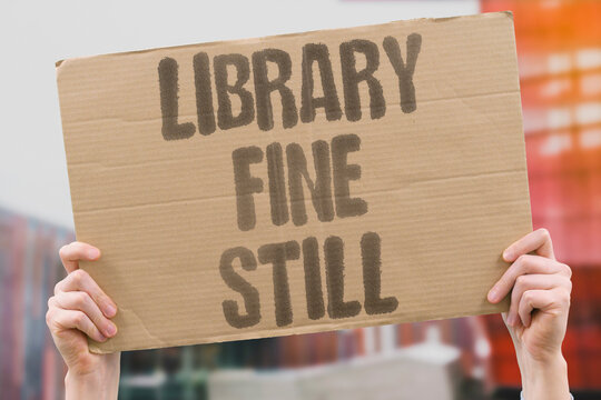 "Library Fine Still" A returned book remains marked as overdue in the system. FINE. OVERDUE. RETURN. SYSTEM. ACCOUNT.