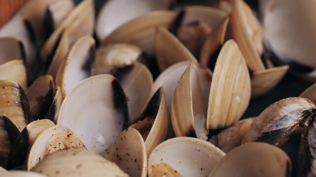 Marinara mussels with garlic, sauce, lemon and parsley. Classic spanish and French meal macro close up.