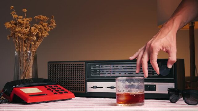 Old Retro AM FM Radio with tubes and red phone, Hand Changing stations , bulb vintage music player.