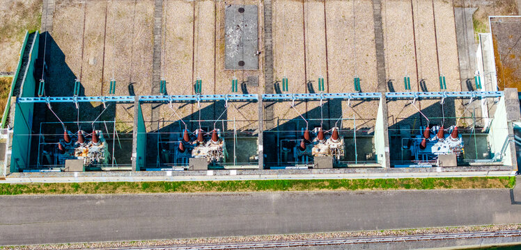 Aerial view of the electrical substation in Vogelgrun featuring high-voltage transformers and power equipment arranged in concrete bays, Vogelgrun, Grand Est, France.