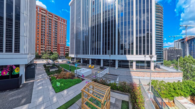 Elevated view overlooks a landscaped plaza surrounded by Rosslyn office towers.