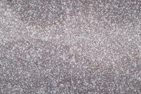 The surface displays a detailed granite texture with various colors and patterns