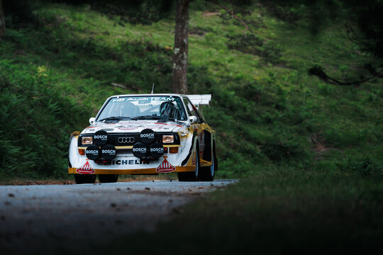 Audi Sport Quattro S1 E2 rally car at the 2025 RallySpirit rally on June 6th, driving on forest road in northern Portugal