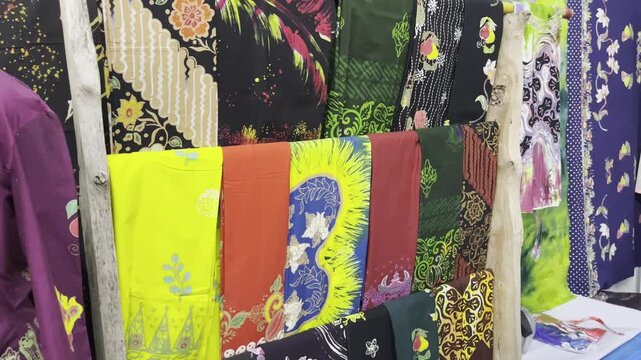 Vibrant Colorful Patterned Batik Clothes Hanging on Rack
