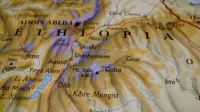close up gliding shot toward addis ababa, ethiopia, on a relief map