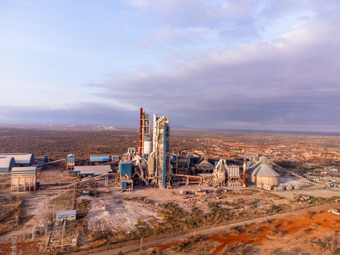 Aerial view of Simba Cement Merueshi industrial plant featuring tall silos and processing structures set within the arid landscape of Kajiado, Kajiado County, Kenya.