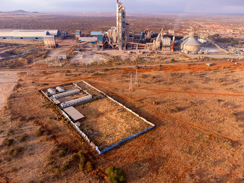 Aerial view of the Simba Cement Merueshi plant, featuring industrial structures, silos, and surrounding arid landscape in Kajiado, Kajiado County, Kenya.