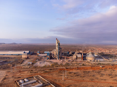 Aerial view of Simba Cement Merueshi industrial facility with large silos and processing structures surrounded by arid landscape in Kajiado, Kajiado County, Kenya.