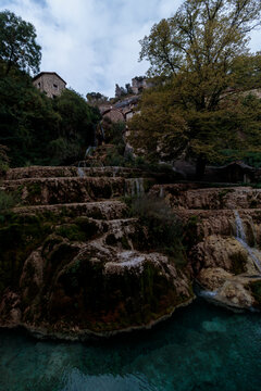 Orbaneja del castillo village waterfall and terraced rock formations