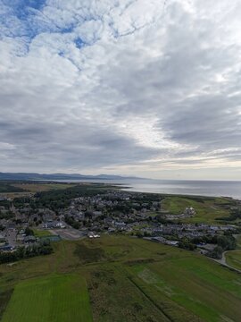 Dornoch is a historic Scottish town beside Dornoch Firth, with cathedral origins in 1224, castle dating 1509&ndash;1512, blue skies, and Highland scenery.