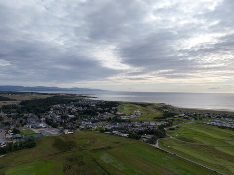 Dornoch is a peaceful Highland town beside the Dornoch Firth, known for its 1224 cathedral, historic castle, blue skies, and sandy shores.