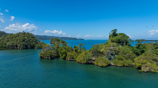 Aerial view of limestone karst islands in Los Haitises National Park, surrounded by turquoise waters in Municipio de Sabana de la Mar, Hato Mayor Province, Dominican Republic.