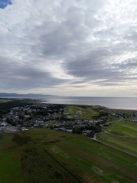 Dornoch is a historic coastal town in Scotland&rsquo;s Highlands, overlooking Dornoch Firth, with medieval landmarks, golden beaches, dramatic skies, and green landscapes.