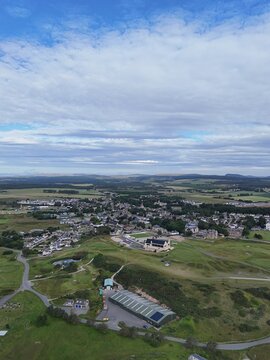 Dornoch is a historic Highland town in northern Scotland, with 1224 cathedral origins, 1509 castle, traditional streets, green landscapes, and open skies.