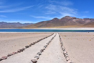 Trail to Laguna Miscanti  - brackish water lake located in the altiplano of the Antofagasta Region in northern Chile. Cerro Miniques volcano and Cerro Miscanti tower over the lake. © Gennady