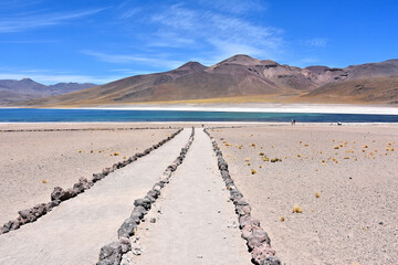 Trail to Laguna Miscanti  - brackish water lake located in the altiplano of the Antofagasta Region in northern Chile. Cerro Miniques volcano and Cerro Miscanti tower over the lake. © Gennady
